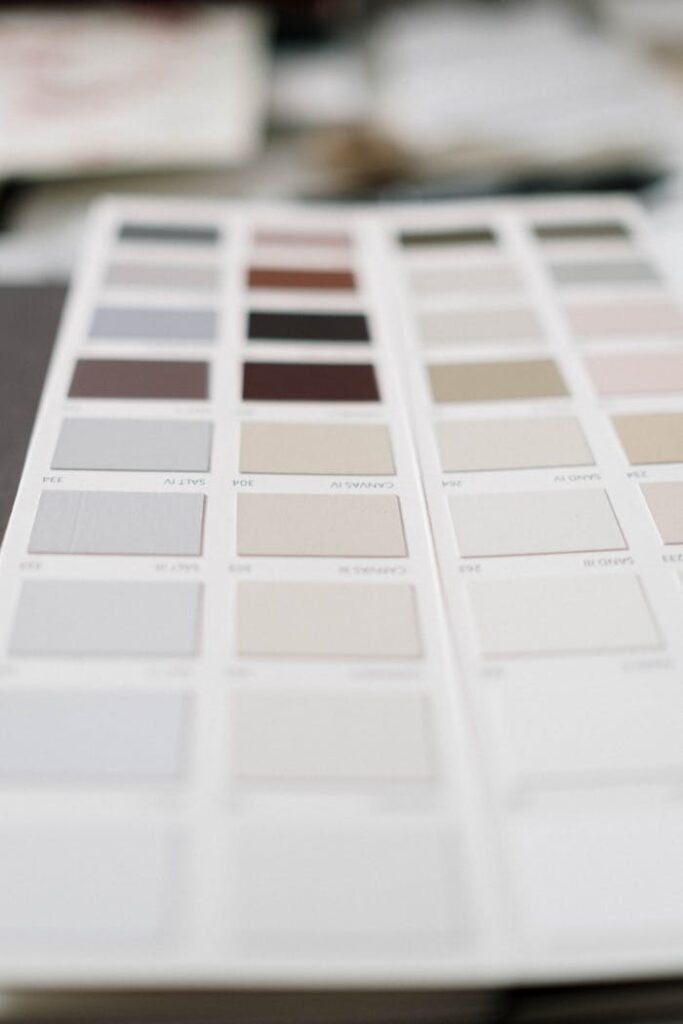 Close-up of a neutral color palette sample sheet showcasing various swatches in soft tones.
